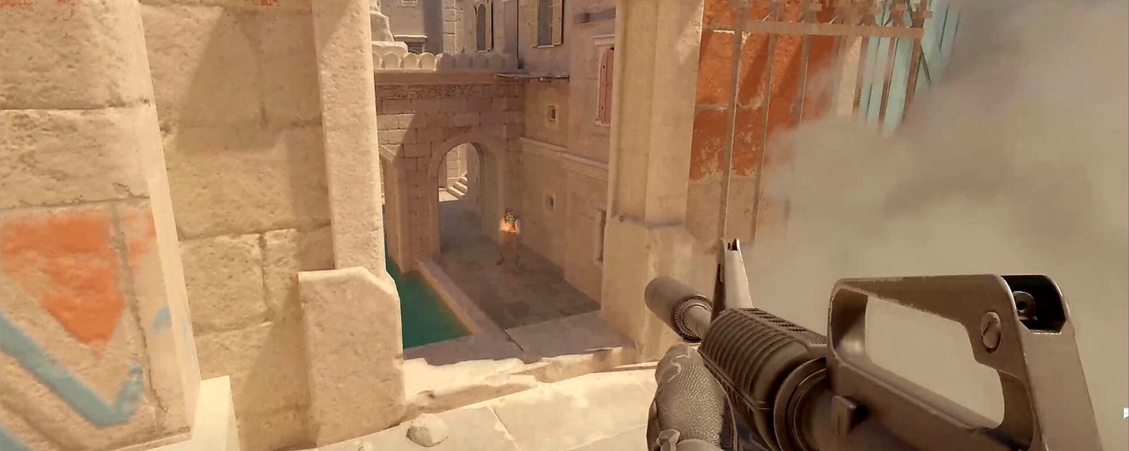 First-person view with an M4 rifle above the canal on Anubis in CS2