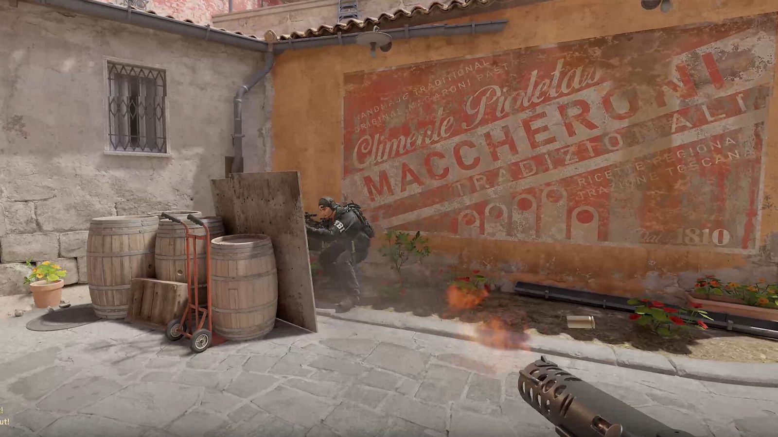 The Macheroni wall on Inferno in CS2, a narrow street with shuttered windows
